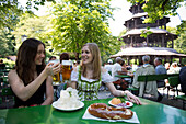 Prost at the beer garden at the Chinese Tower in the English Garden, Munich, Bavaria