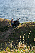 Cannon with blond boy on the fortress of Varberg, Sweden