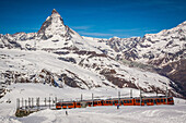 view of the matterhorn from the gornergrat with the gornergrat railway in the foreground, train, matterhorn, ski resort, zermatt, canton of valais, switzerland