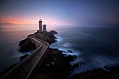 long exposure shot of the lighthouse of the petit-minou in the mist at the first light of day, brest, finistere (29), brittany, france