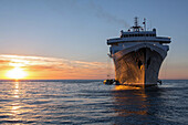 sunset over the astoria cruise ship, ilulissat, greenland