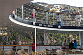 passengers on the ocean liner's deck to admire the landscape, astoria cruise ship, fjord in the prince christian sound, greenland