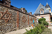 star of david on the inner wall of the grand chateau of menilles (27), france
