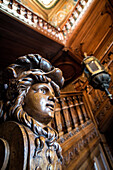 sculpted wooden bust, stairway in the chateau de bizy, vernon (27), france