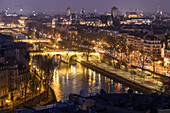 the quays of the seine at night, right bank and the hotel de ville, seen from the pavilion of the arsenal, paris (75), france