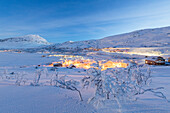 Illuminated village of Riksgransen at dusk, Abisko, Kiruna Municipality, Norrbotten County, Lapland, Sweden, Scandinavia, Europe