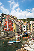 The colourful buildings and boats in Riomaggiore harbour, Cinque Terre, UNESCO World Heritage Site, Liguria, Italy, Europe