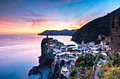 The remains of a stunning sunset over the old town and harbour of Vernazza, Cinque Terre, UNESCO World Heritage Site, Liguria, Italy, Europe