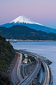 Mount Fuji and traffic driving on the Tomei Expressway, Shizuoka, Honshu, Japan, Asia