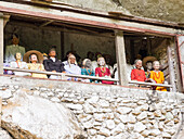 A gallery of tao-taos (statues of ancestors) at a cliff gravesite, Tana Toraja, Sulawesi, Indonesia, Southeast Asia, Asia