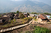 Recently constructed concrete steps to ease access between higher and lower sections of village on steep Naga hillside, Nagaland, India, Asia