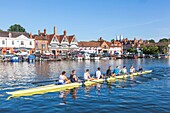 England,Oxfordshire,Henley-on-Thames,Town Skyline and Rowers on River Thames