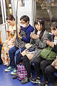 Japan, Honshu, Tokyo, Subway Passengers