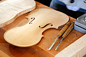 Crafts. Artisan luthier. Close-up on a violin being made.