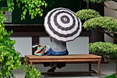 Woman with umbrella in Tochoji temple, Fukuoka, Japan, Asia