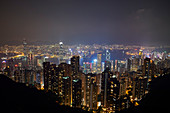 View at night of central Hong Kong and Victoria Harbour from Victoria Peak, looking toward Kowloon in background, Hong Kong, China, Asia