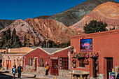 Street scene, with the Hill of Seven Colours in the background, Purmamarca, North West Argentina, South America