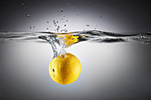 Close-up of lemon in splashing water