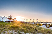 Kurhaus and beach chairs at sunset, Binz, Ruegen Island, Mecklenburg-Western Pomerania, Germany