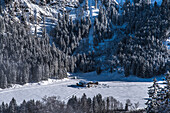 Germany, Bavaria, Alps, Oberallgäu, Oberstdorf, Stillachtal, Winter landscape, Winter holidays, Mountain farm surrounded by a coniferous forest, Mountains