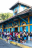Bus station in Cienfuegos, people queuing, waiting, colonial town, family travel to Cuba, parental leave, holiday, time-out, adventure, Cienfuegos, Cuba, Caribbean island