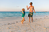 Mother and little son on Cayo Coco beach, sandcastle, sandy dream beach, turquoise blue sea, Memories Flamenco Beach Resort, hotel, family travel to Cuba, parental leave, holiday, time-out, adventure, MR, Cayo Coco, Jardines del Rey, Provinz Ciego de Ávil