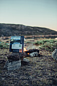 instant meal in front of a fire, greenland, arctic.