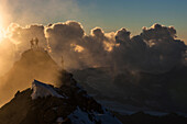 Mountaineer at summit, Matterhorn, Zermatt, Switzerland.