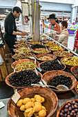 market stall with olives,  Marche de Capucins, Bordeaux, France