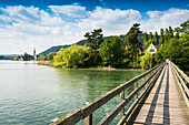 Wooden bridge crossing the Rhine River to the monastery island of Werd, Stein am Rhein, Lake Constance, Canton of Schaffhausen, Switzerland