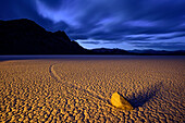 Sailing stone with race track in clay pan, Racetrack Playa, Death Valley National Park, California, USA