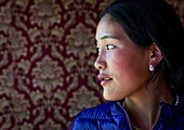 Portrait of a beautiful tibetan nomad woman, Tongren County, Longwu, China.