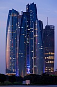 UAE, Abu Dhabi, Etihad Towers, dusk.