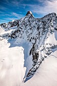 Aerial view of the north wall of Monte Disgrazia, Disgrazia Mount, covered with snow and ice, Valmalenco, Valtellina, Italy.