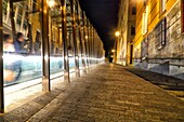 Street scene at night, stairs and moving walkway connecting old town with the city, Vitoria-Gasteiz, Alava, Basque Country, Spain
