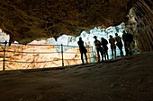 Tourists admire the incredible cave of Neptune. Alghero, Sardinia. Italy.
