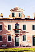 ITALY, Venice. The front of a house located in the Castello district. Castello is the largest of the six sestieri of Venice.