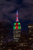 Empire State Building In Christmas Colours; New York City, New York, United States Of America