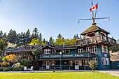 The heritage site tourist attraction Union Steamship Building in Snug Cove, Bowen Island welcoming tourists as they come off the ferry from Vancouver to the island; Bowen Island, British Columbia, Canada