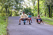 Family playing in park, Bedugul, Bali, Indonesia