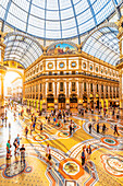 Galleria Vittorio Emanuele II, Milan, Lombardy, Italy, Tourists walking in the world's oldest shopping mall