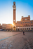 Siena, Tuscany, Italy, Europe. View of Piazza del Campo with the historical Palazzo Pubblico and its Torre del Mangia.