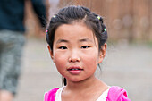 Portrait of a Mongolian little girl. Huzirt, South Hangay province, Mongolia.