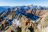 Alpinism in the peaks of Retiche Alps in Valtellina, Lombardy, Italian Alps