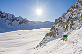 Freeride skier in a sunny day - Col de l'Evoque - Swiss Alps