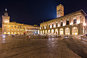 View of the Palazzo del Podestà and Palazzo d'Accursio from Piazza Maggiore square at night. Bologna, Emilia Romagna, Italy.