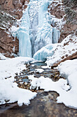 Icy waterfall near Falzarego pass, Ampezzo Dolomites natural park, Cortina d' Ampezzo, Belluno, Veneto, Italy