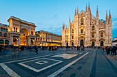 Milan, Lombardy, Italy, The facade of the Milan's Cathedral at sunset with gallery Vittorio Emanuele