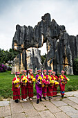 Sani minority girls with traditional dress at Stone Forest or Shilin, Kunming, Yunnan Province, China, Asia, Asian, East Asia, Far East
