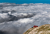 Franchetti Mountain Hut floats on the clouds, Gran Sasso, Teramo province, Abruzzo, Italy, Europe
